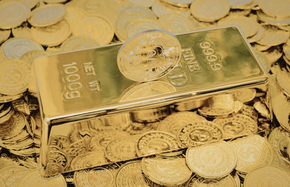 Gold bar surrounded by many gold coins